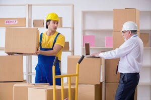 Family with moving boxes — Leoin Packers and Movers Bangalore