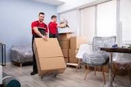 Movers handling a couch — Leoin Packers and Movers Bangalore